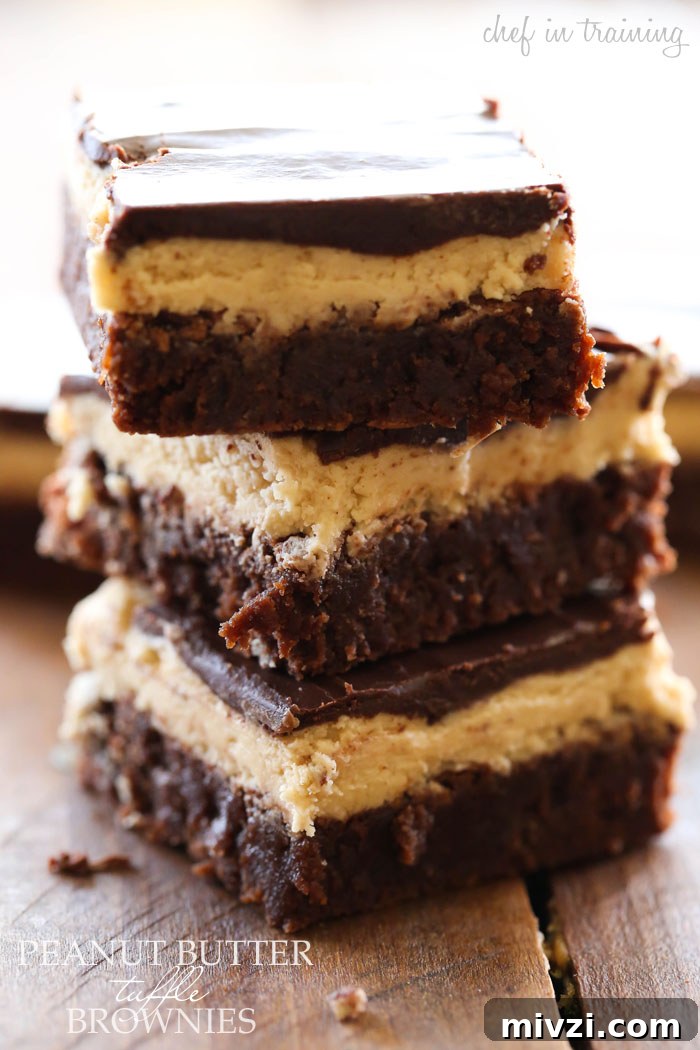 Peanut Butter Truffle Brownies... OH MY GOSH! These are INCREDIBLE! Layers of fudgy brownie, soft truffle and chocolate ganache combine to make one unforgettable dessert!