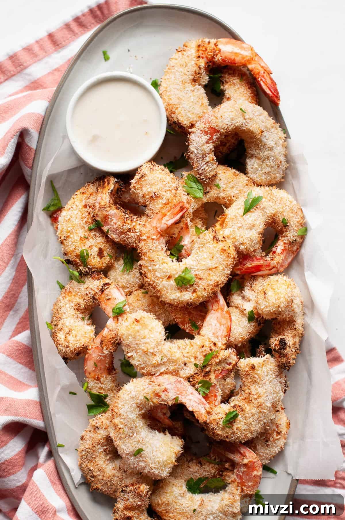 Crispy Coconut Shrimp Made in the Air Fryer 3 air fried coconut shrimp on plate