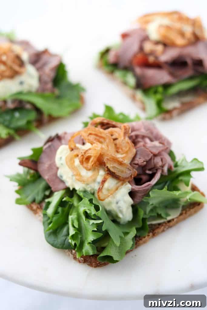 A open roast beef sandwich on a plate