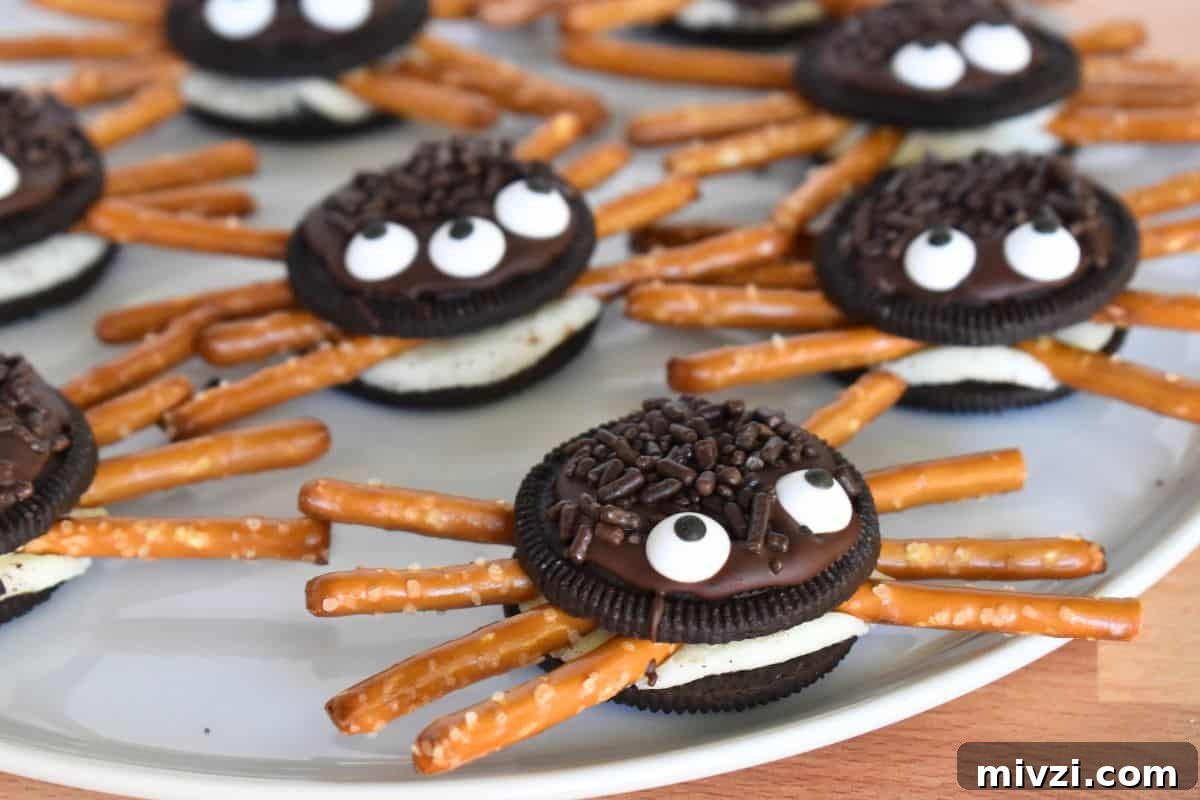 Oreo Spider Cookies: Fun Halloween Treat Recipe 6 Oreo Cookie Spiders on a white plate.