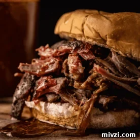 Shredded smoked lamb shoulder on a bun.