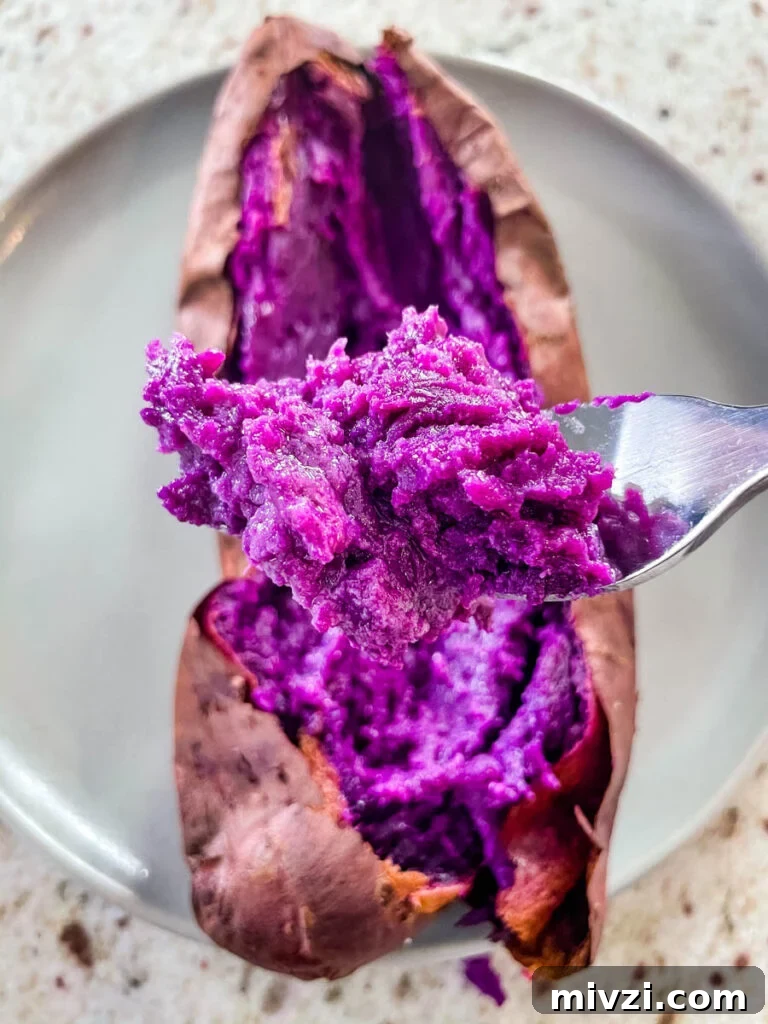 How to Cook Purple Sweet Potatoes: Simple Recipes & Techniques 5 a spoonful of fully cooked Stokes purple sweet potato