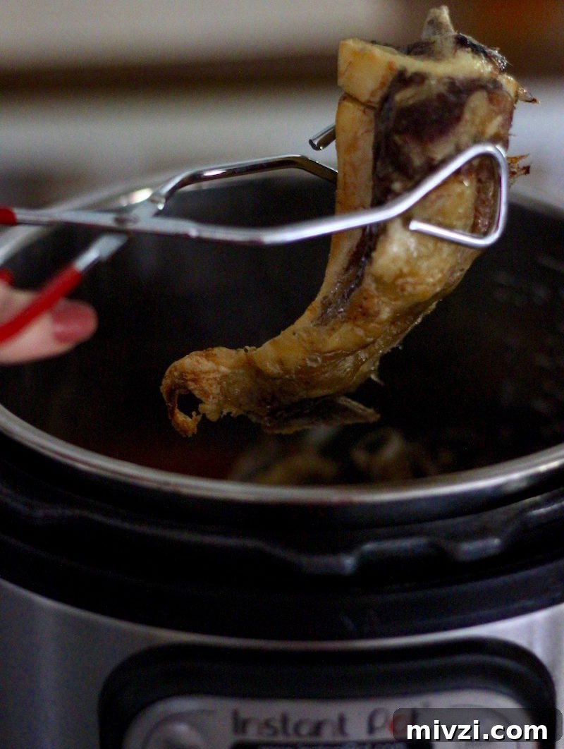 AIP Instant Pot Bone Broth Recipe for Gut Healing and Immunity 8 Instant Pot Bone Broth (AIP) - a nutrient-dense broth packed with healing benefits, made easy in the Instant Pot!