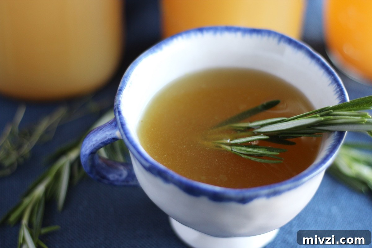 Instant Pot Bone Broth (AIP) - warm, comforting bone broth, full of nutrients, herbs, and spices, made easy in the Instant Pot!
