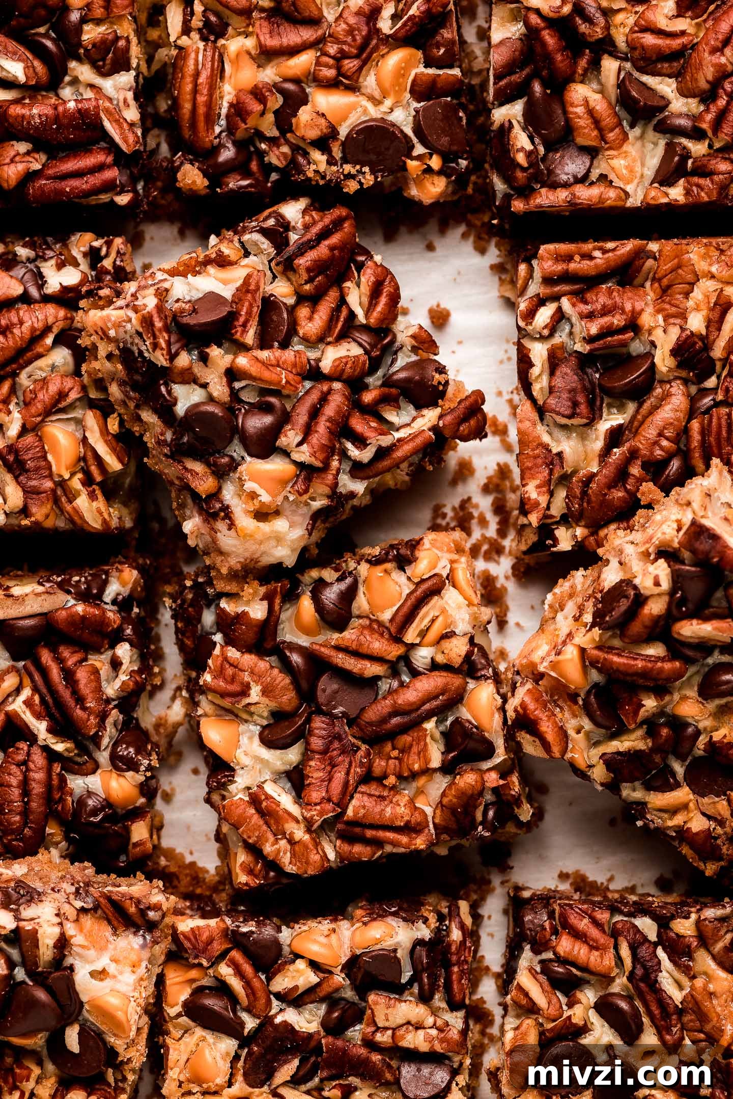 Square bars topped with chocolate chips, nuts, and butterscotch chips.
