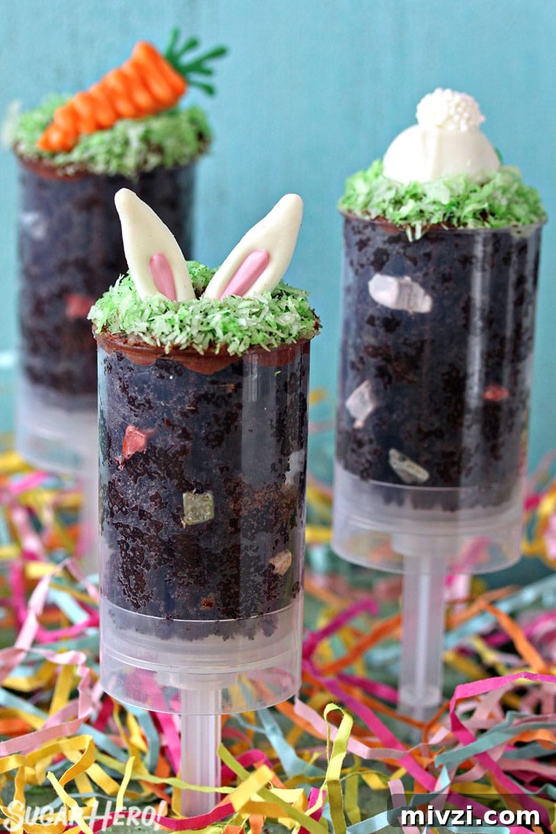 Easter Chocolate Push-Up Pops: Festive Treats for Kids 2 Three Easter push-up pops filled with chocolate cake and topped with bunny ears, a bunny butt or a chocolate carrot.