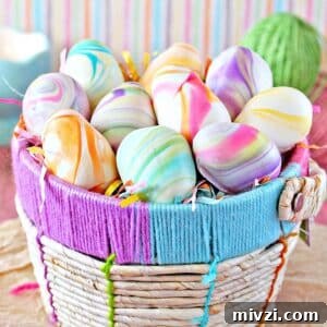 Easter Chocolate Push-Up Pops: Festive Treats for Kids 11 Colorful pastel truffles shaped like eggs in a woven Easter basket.
