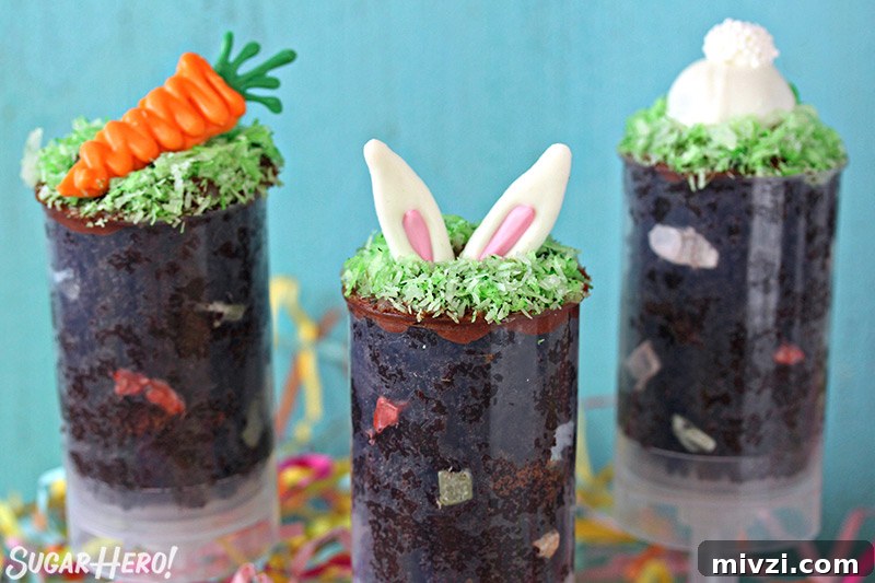 Easter Chocolate Push-Up Pops: Festive Treats for Kids 5 Three Easter push-up pops filled with chocolate cake and topped with bunny ears, a bunny butt or a chocolate carrot.