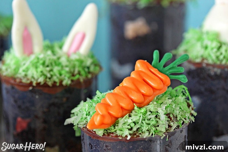 Easter Chocolate Push-Up Pops: Festive Treats for Kids 7 Close up of Easter push-up pop topped with a carrot made from candy melt.