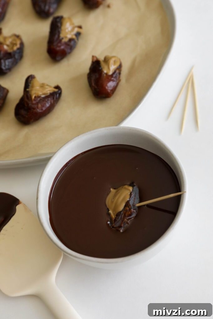 Chocolate-Covered Dates Stuffed with Strawberries for Parties 9 Chocolate Strawberry Covered Dates process photo by Flora & Vino