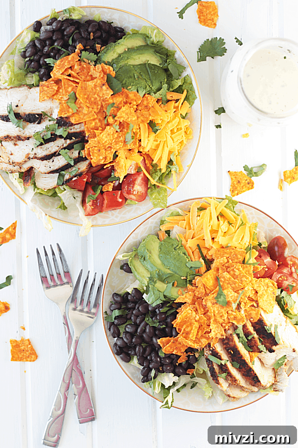 overhead shot of chicken taco salad with doritos on top