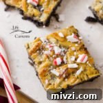 Peppermint Magic Bars With layers of chocolate cookie crust, chocolate chips, peppermint bark, coconut, and almonds, your taste buds are in for a yummy holiday treat.