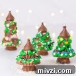 square crop of 4 peanut butter cup Christmas trees with twinkle lights in background