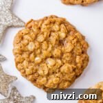 oatmeal cookies with silver glitter stars on a white background