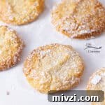 Almond Cloud cookies on a piece of parchment paper.