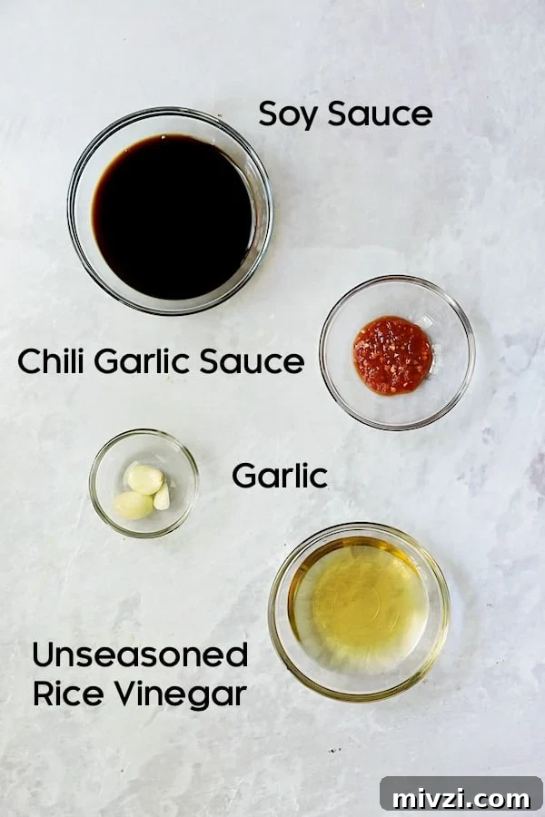 Crispy Beer-Battered Shishito Tempura with Spicy Garlic Dipping Sauce 5 Photo of ingredients for Spicy Garlic Dipping Sauce in glass bowls.