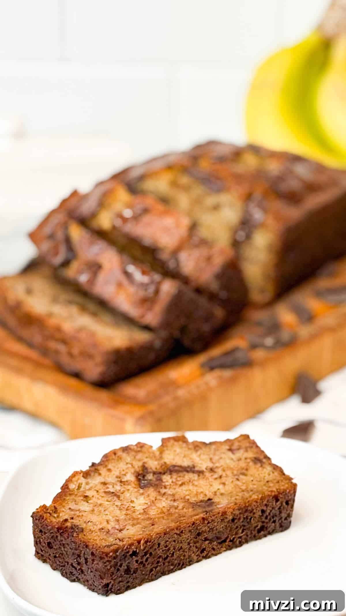 Chocolate Chunk Banana Bread Recipe with Gooey Chocolate Chunks 6 Sliced and ready to enjoy.