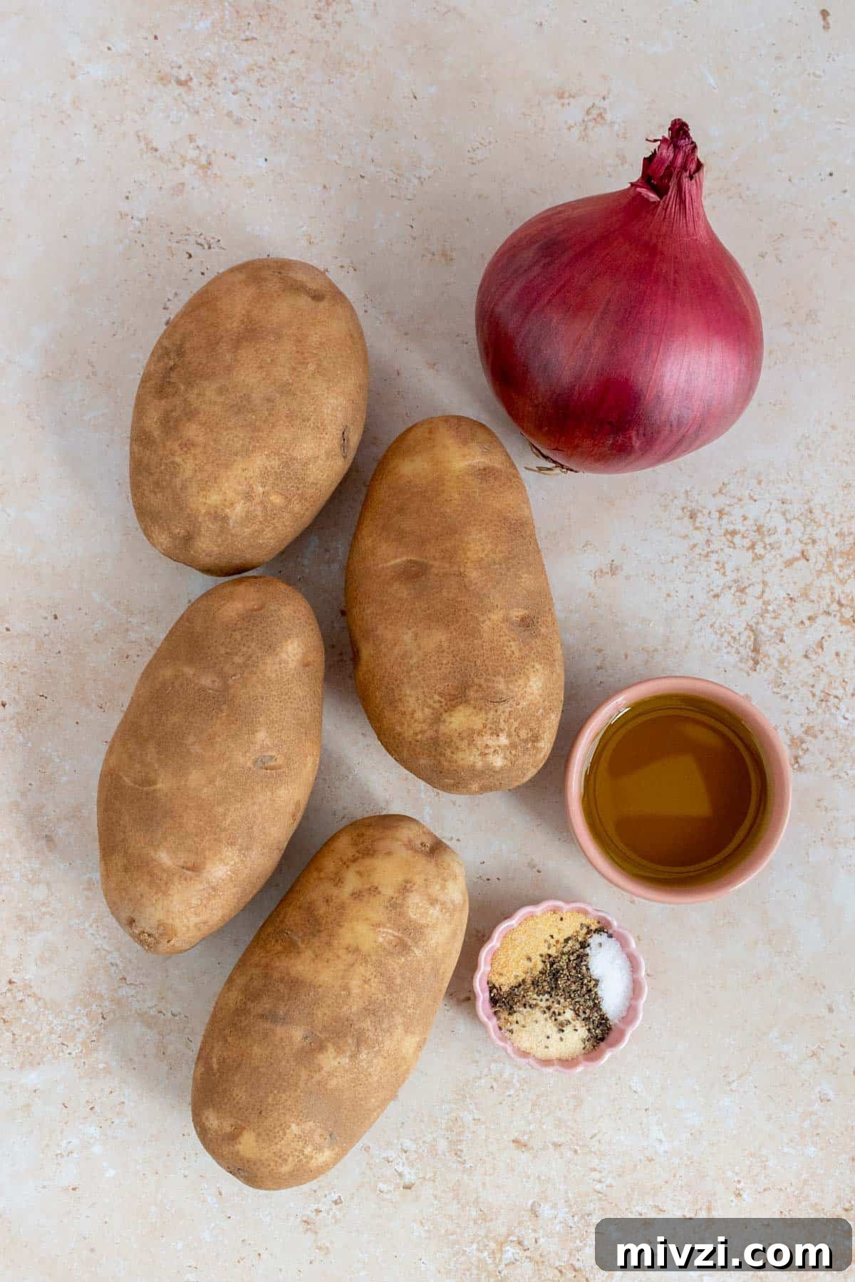 Ingredients needed to make air fryer potatoes and onions.