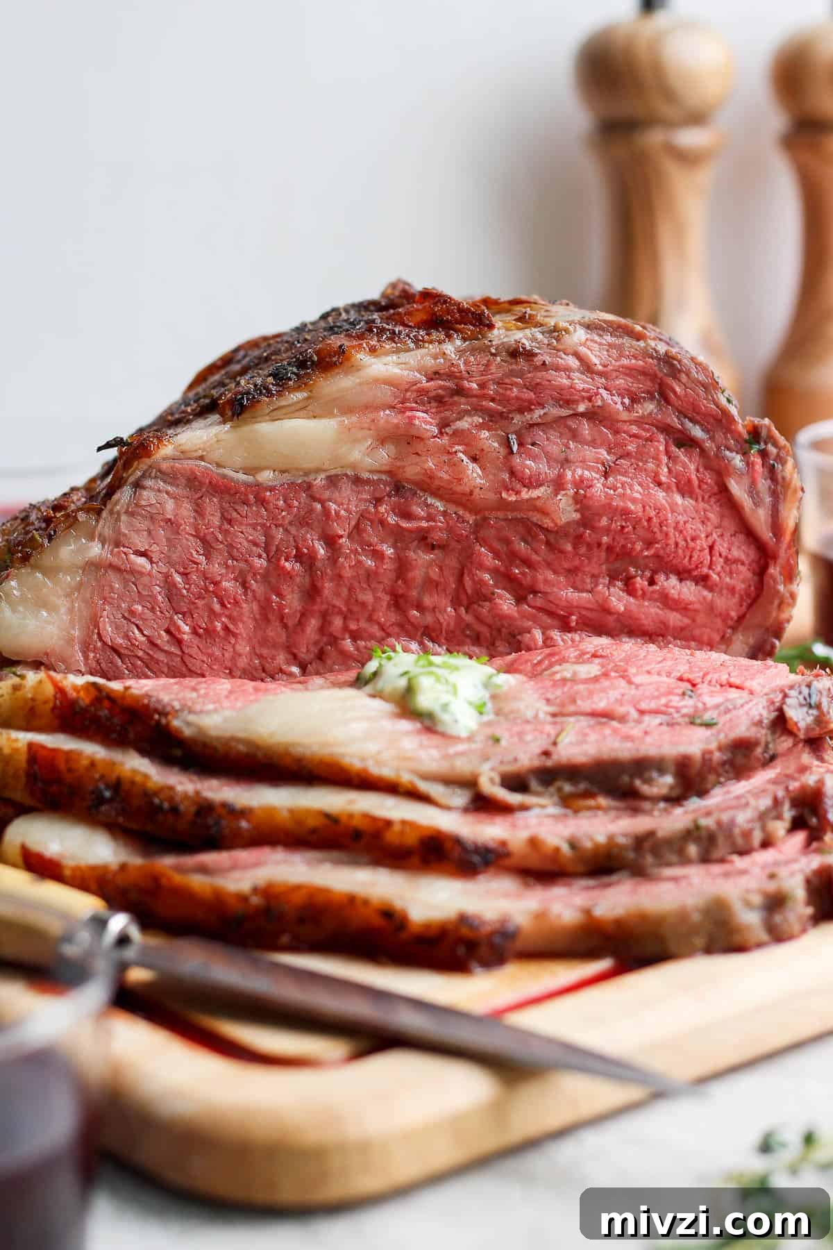 Sliced prime rib on the cutting board.