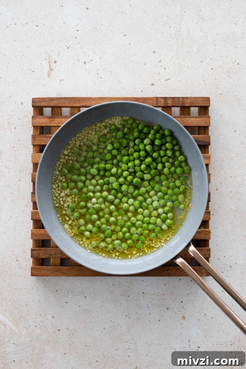 Peas in a small skillet with olive oil.