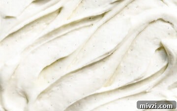 Quick Double Vanilla Buttercream Recipe in 5 Minutes 5 Close up of vanilla bean frosting swirls