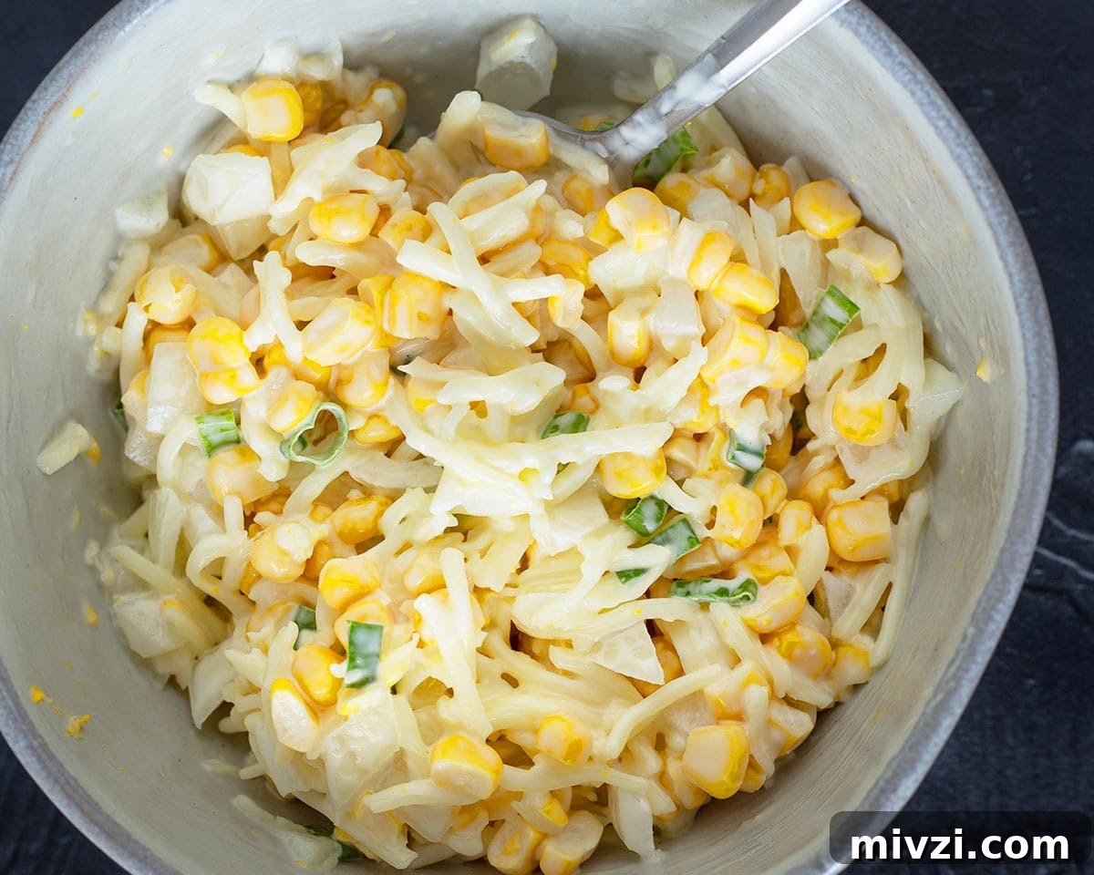 Mixing the hotdog bread topping together in a bowl.