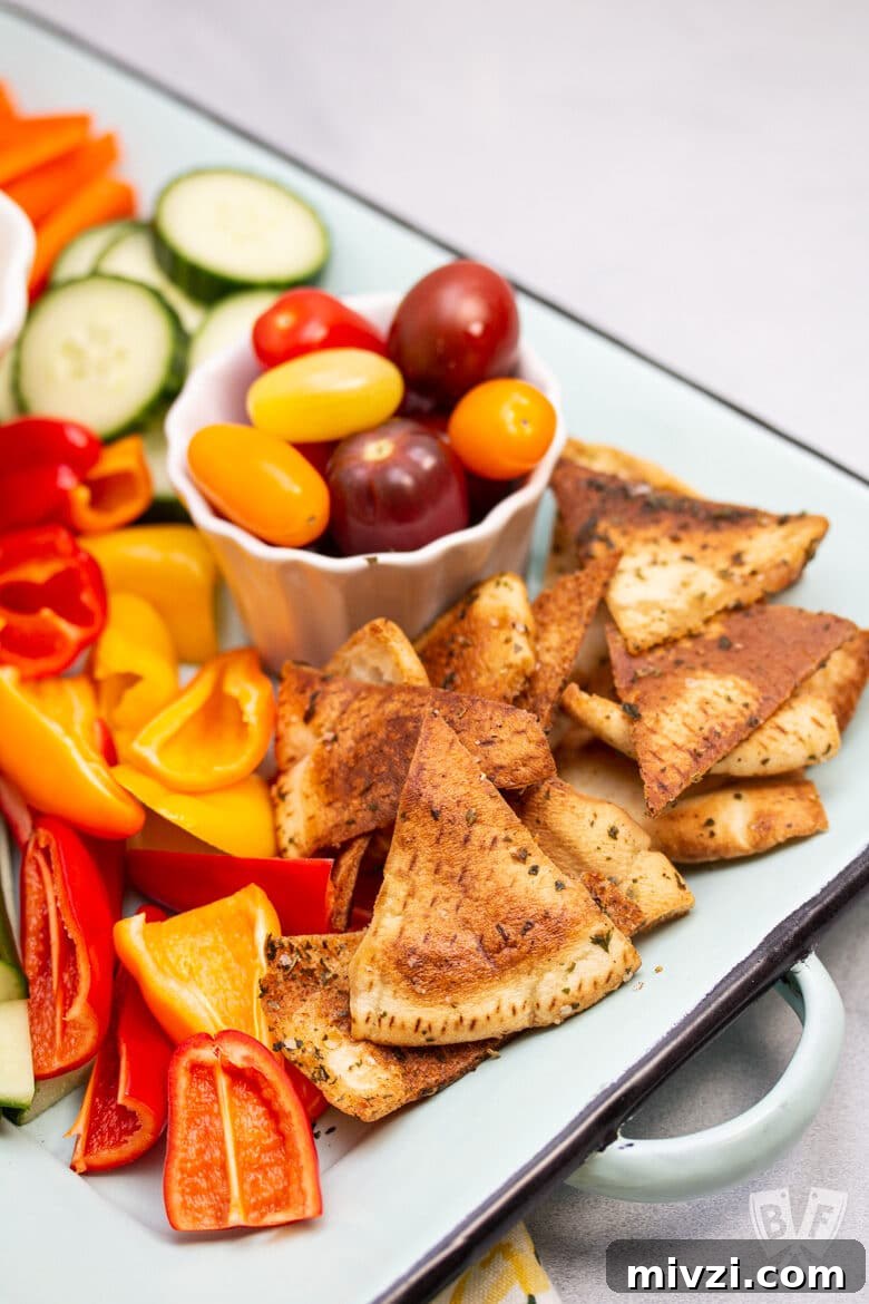 Classic Hummus from Canned Chickpeas – Quick Authentic Recipe 14 Platter of colorful veggies and pita chips.