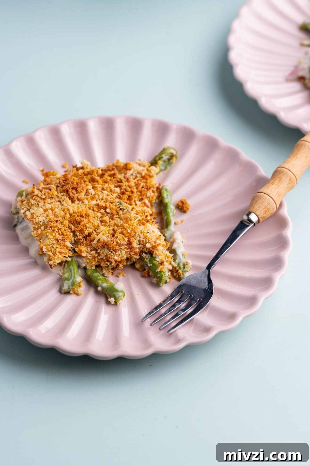 Cheesy Baked Asparagus Casserole Recipe with Crispy Top 2 Asparagus Casserole with crispy Panko top served on a plate with a fork