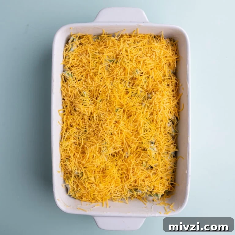 Cheesy Baked Asparagus Casserole Recipe with Crispy Top 21 Casserole dish with asparagus in cream of mushroom soup topped with cheddar cheese