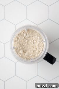Processed oat flour in a blender jar.