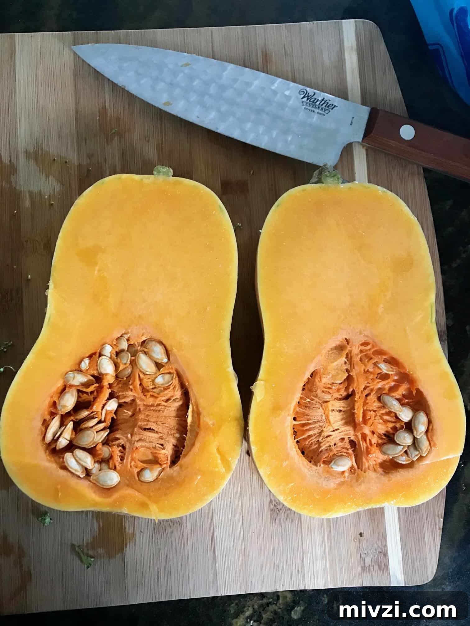 How to Cut a Butternut Squash Safely and Quickly 3 Butternut squash on cutting board cut in half