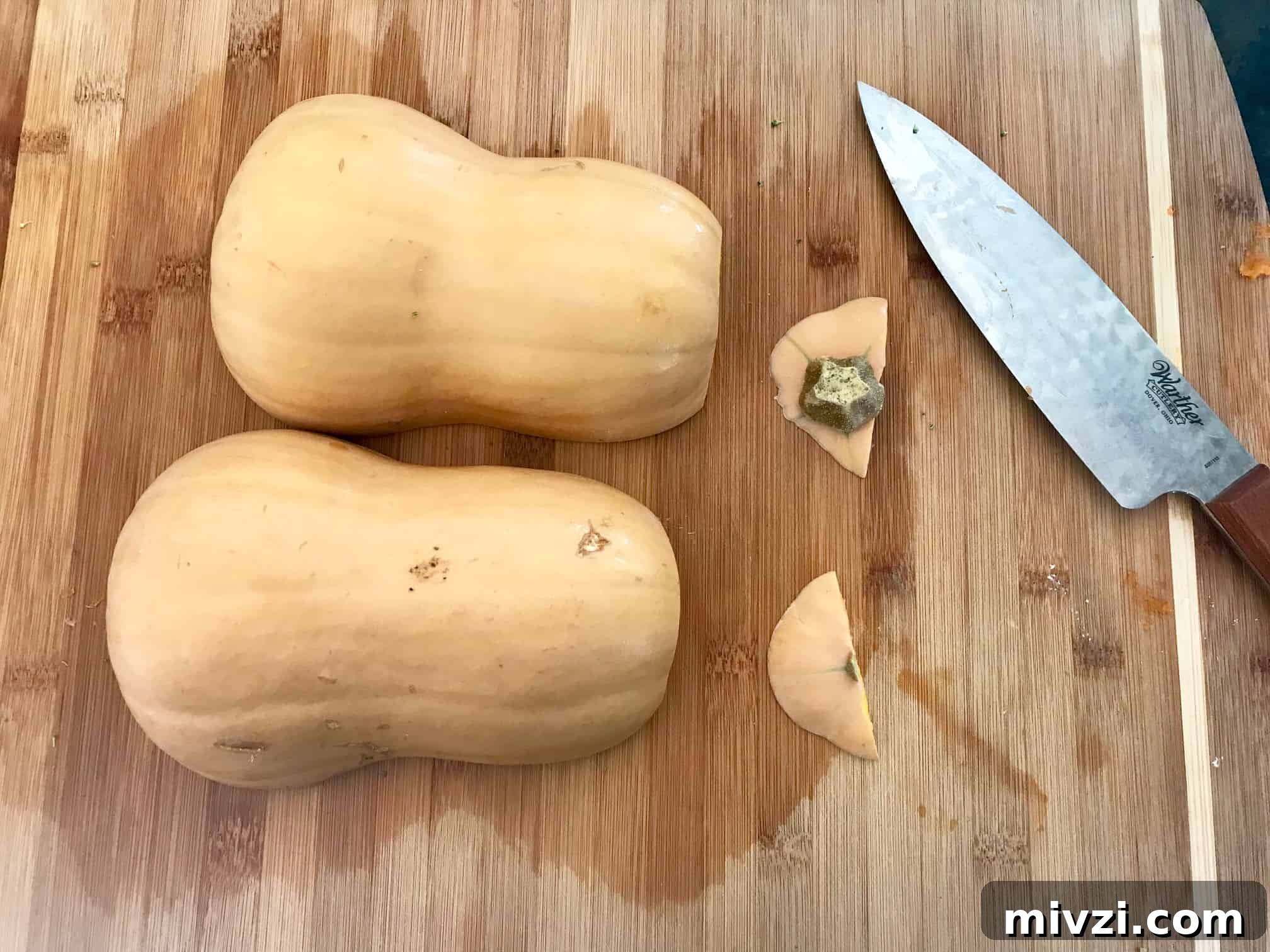 How to Cut a Butternut Squash Safely and Quickly 5 Butternut squash on cutting board cut in half with tops cut off