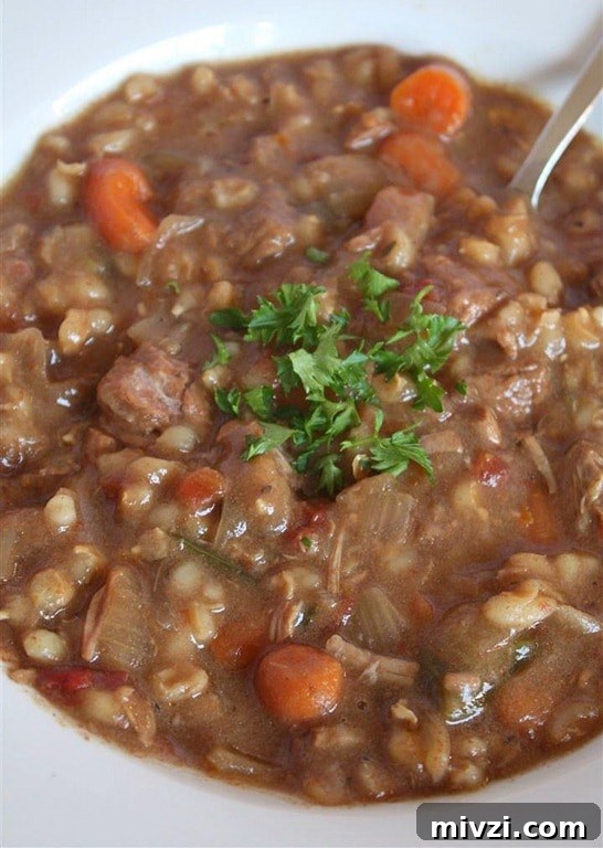 Slow Cooker Beef Barley Soup by Nutmeg Nanny A hearty slow cooker beef barley soup will stick to your bones and keep you full all winter long. It's packed full of vegetables, barley and beef.