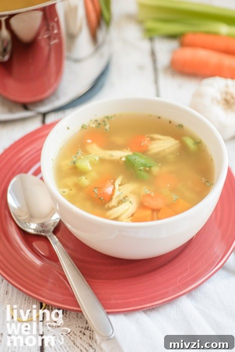 Bowl of whole30 chicken soup with celery and carrots