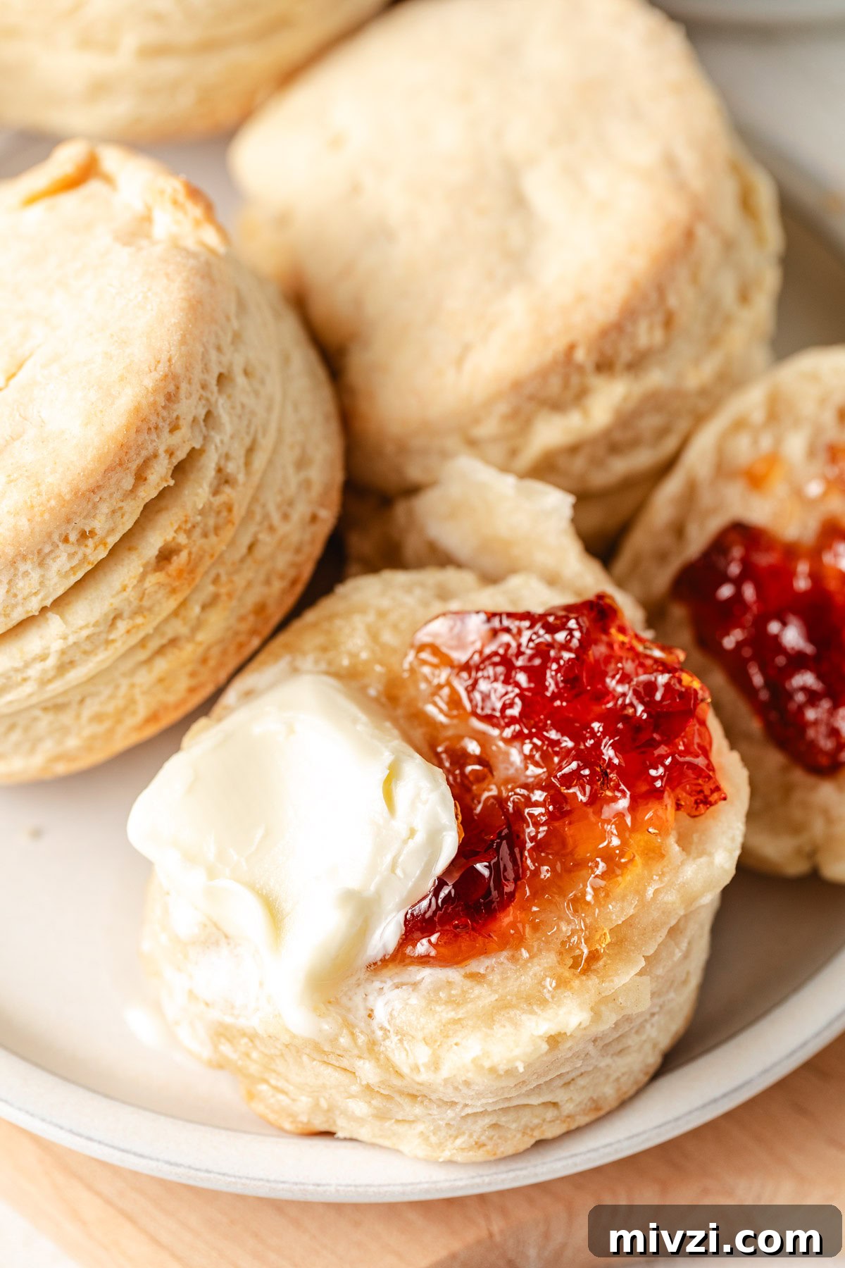 How to Make Perfectly Flaky Homemade Biscuits 2 Butter and jelly on a homemade biscuit.
