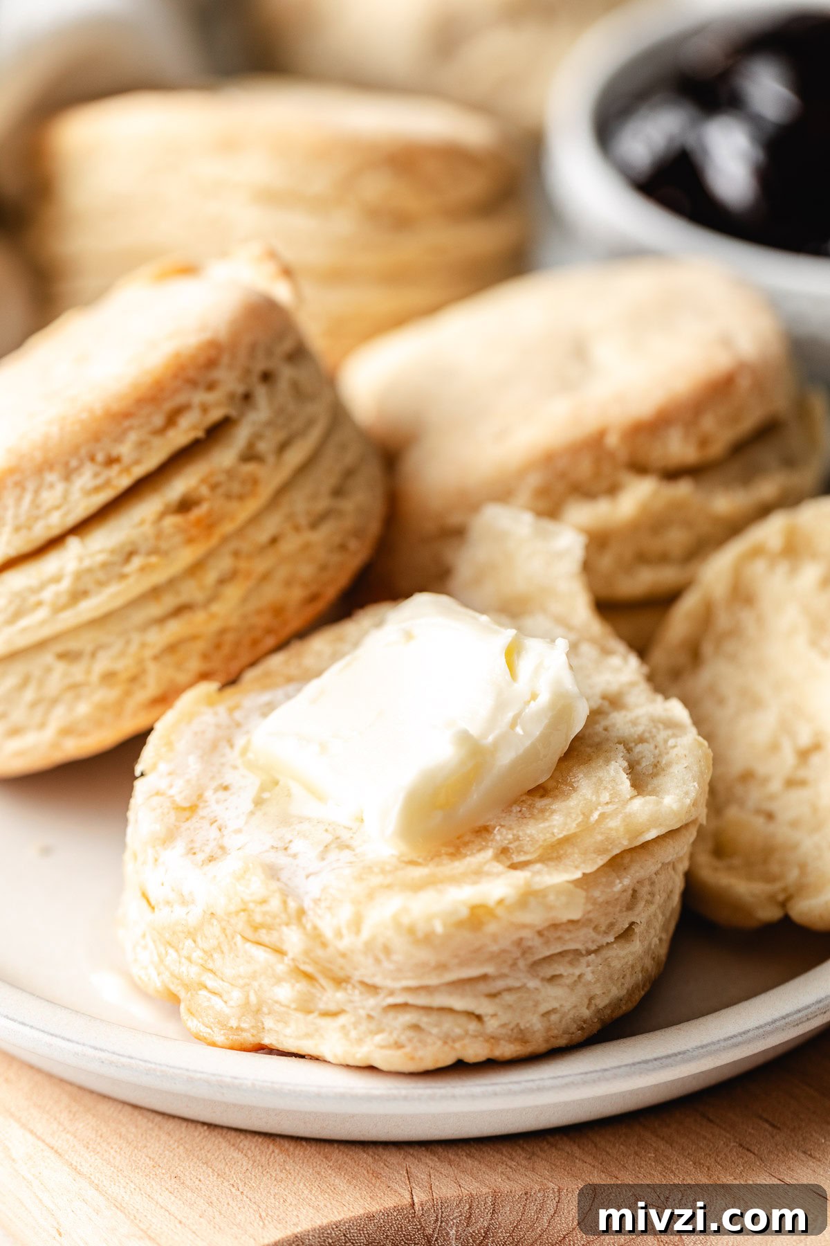How to Make Perfectly Flaky Homemade Biscuits 3 Butter on a homemade biscuit.
