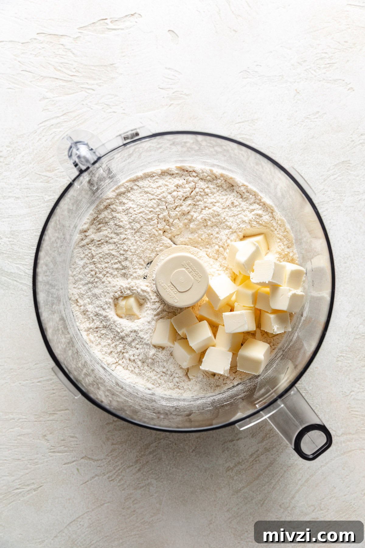 How to Make Perfectly Flaky Homemade Biscuits 4 Cubed butter on top of flour, baking powder and salt.