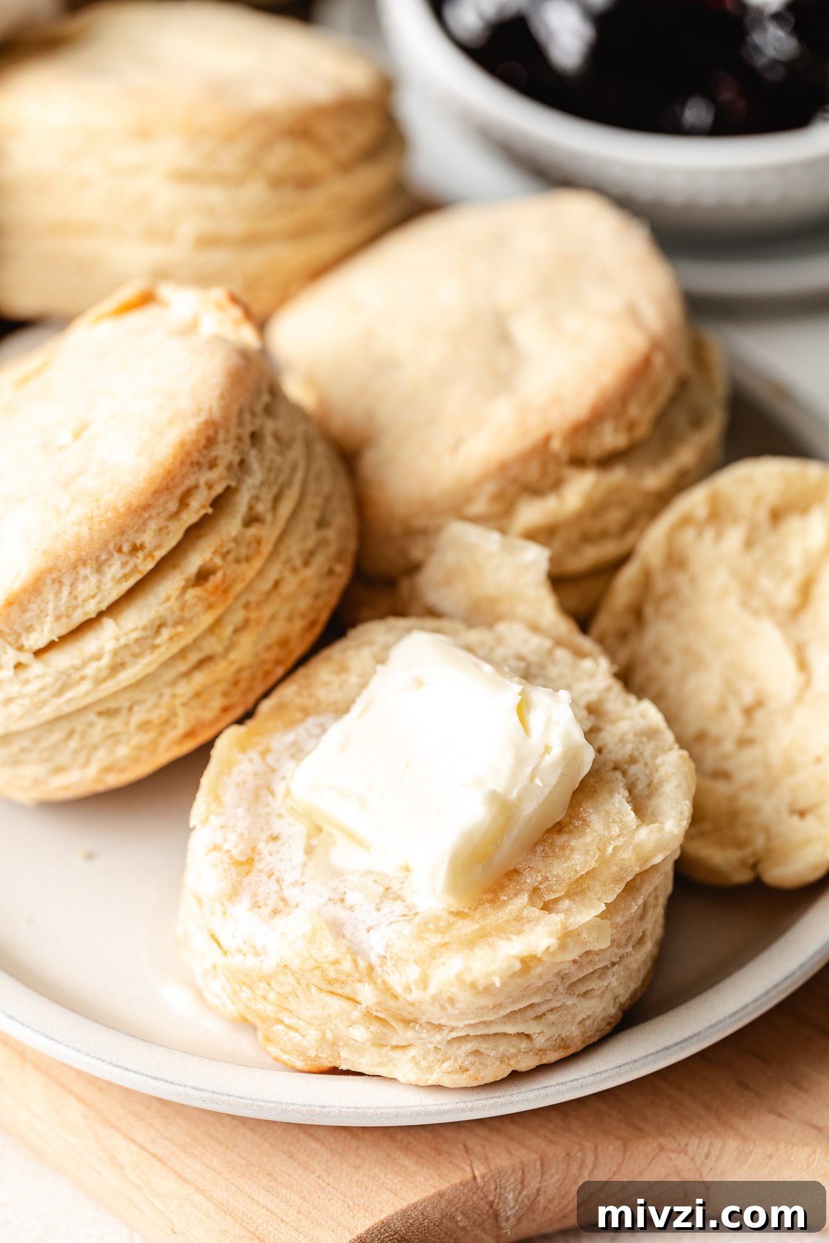 How to Make Perfectly Flaky Homemade Biscuits 10 Pat of butter on a biscuit.