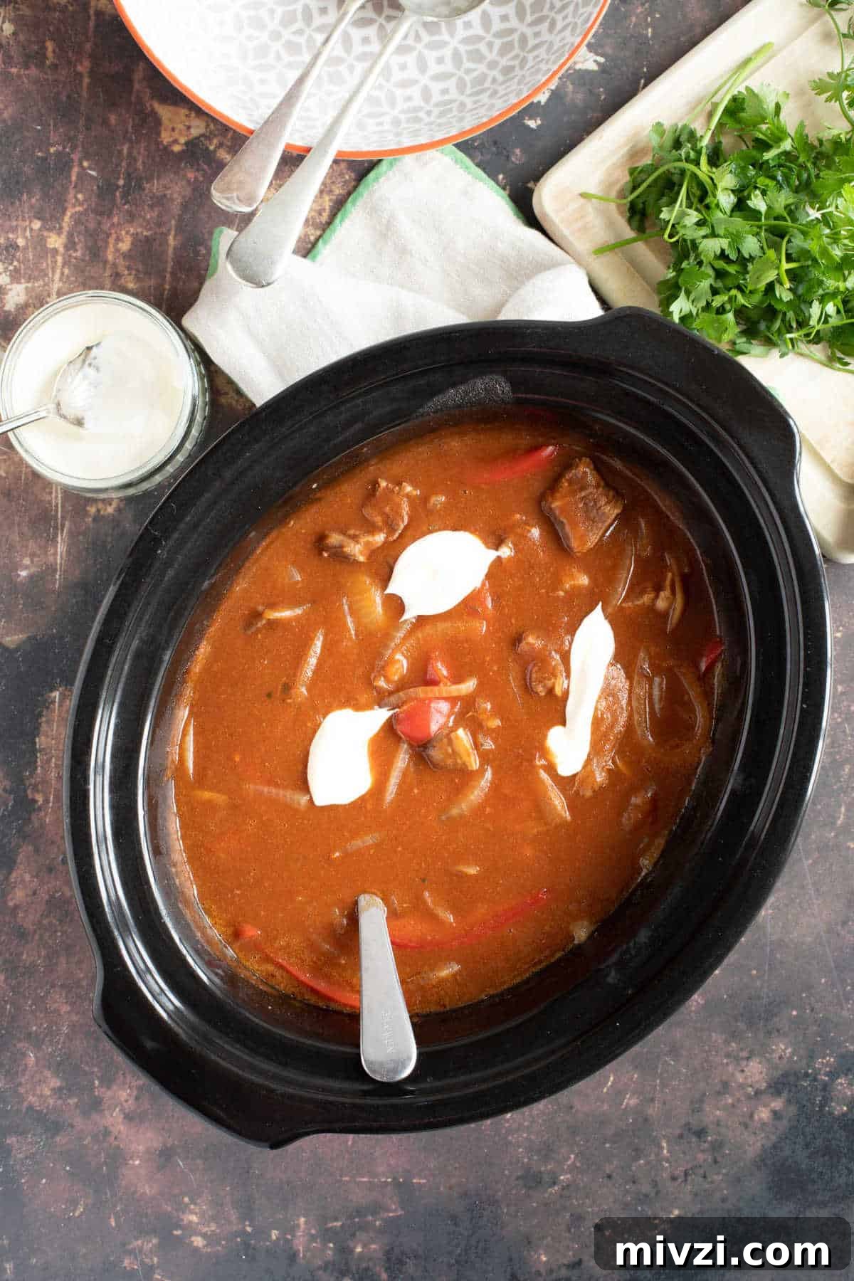 Hearty Slow Cooker Beef Goulash Recipe for Tender, Savory Meals 2 Beef goulash in a slow cooker.