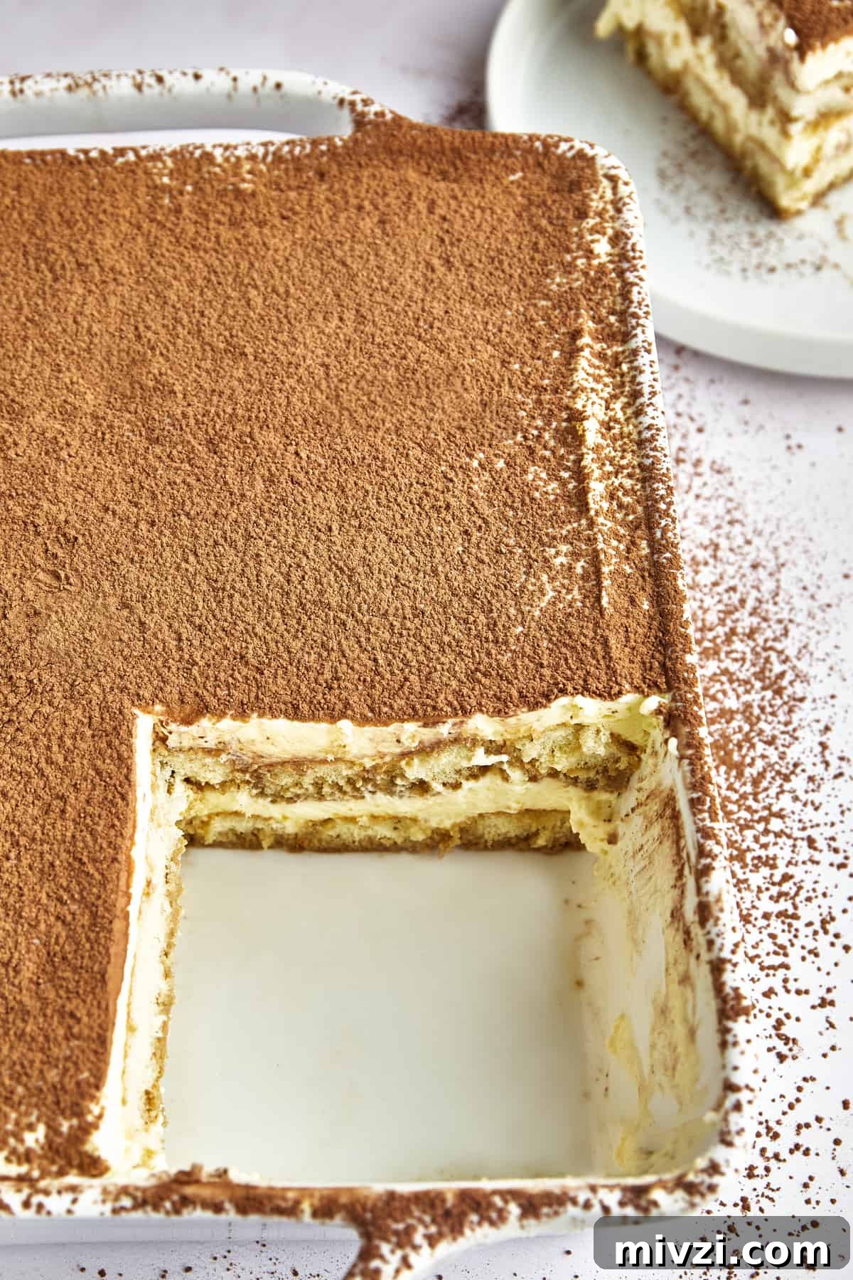 Classic Tiramisu Recipe: Step-by-Step Italian Dessert Guide 4 Serving of tiramisu garnished with cocoa