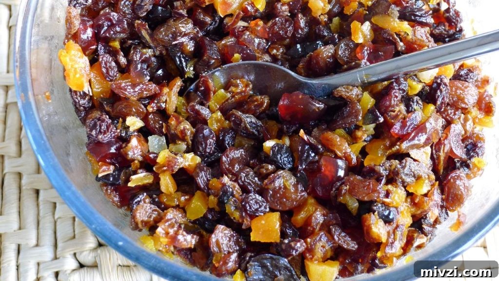Dairy-Free Gluten-Free Christmas Cake Recipe 5 A close up of a glass bowl full of dried fruits soaking.