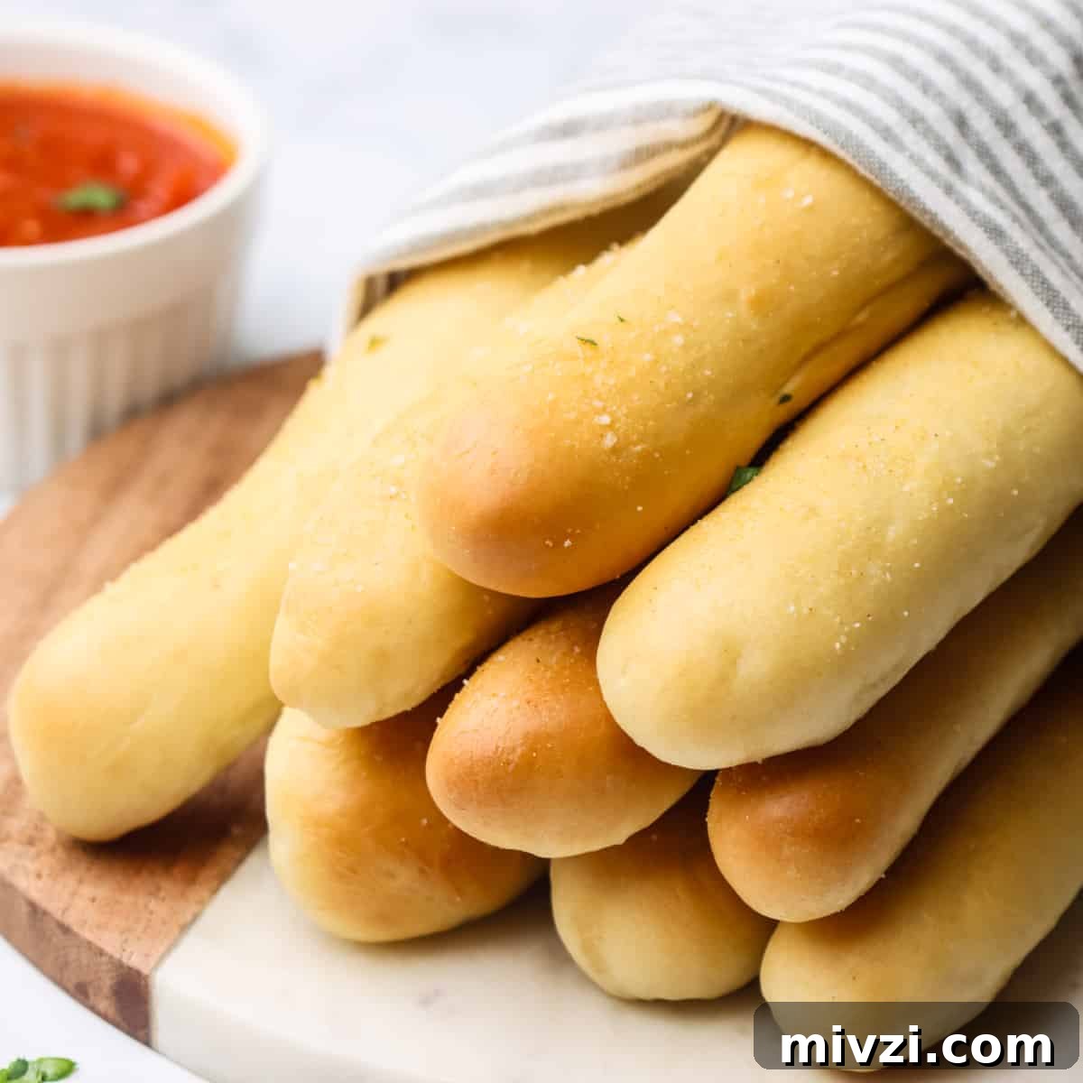 Crispy Homemade Breadsticks Recipe for Perfect Dinner Sides 2 a stack of 9 homemade breadsticks