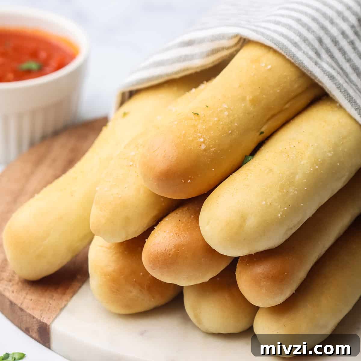 Crispy Homemade Breadsticks Recipe for Perfect Dinner Sides 14 a stack of 9 homemade breadsticks
