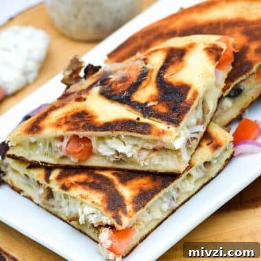 greek gyro quesadillas on a white platter