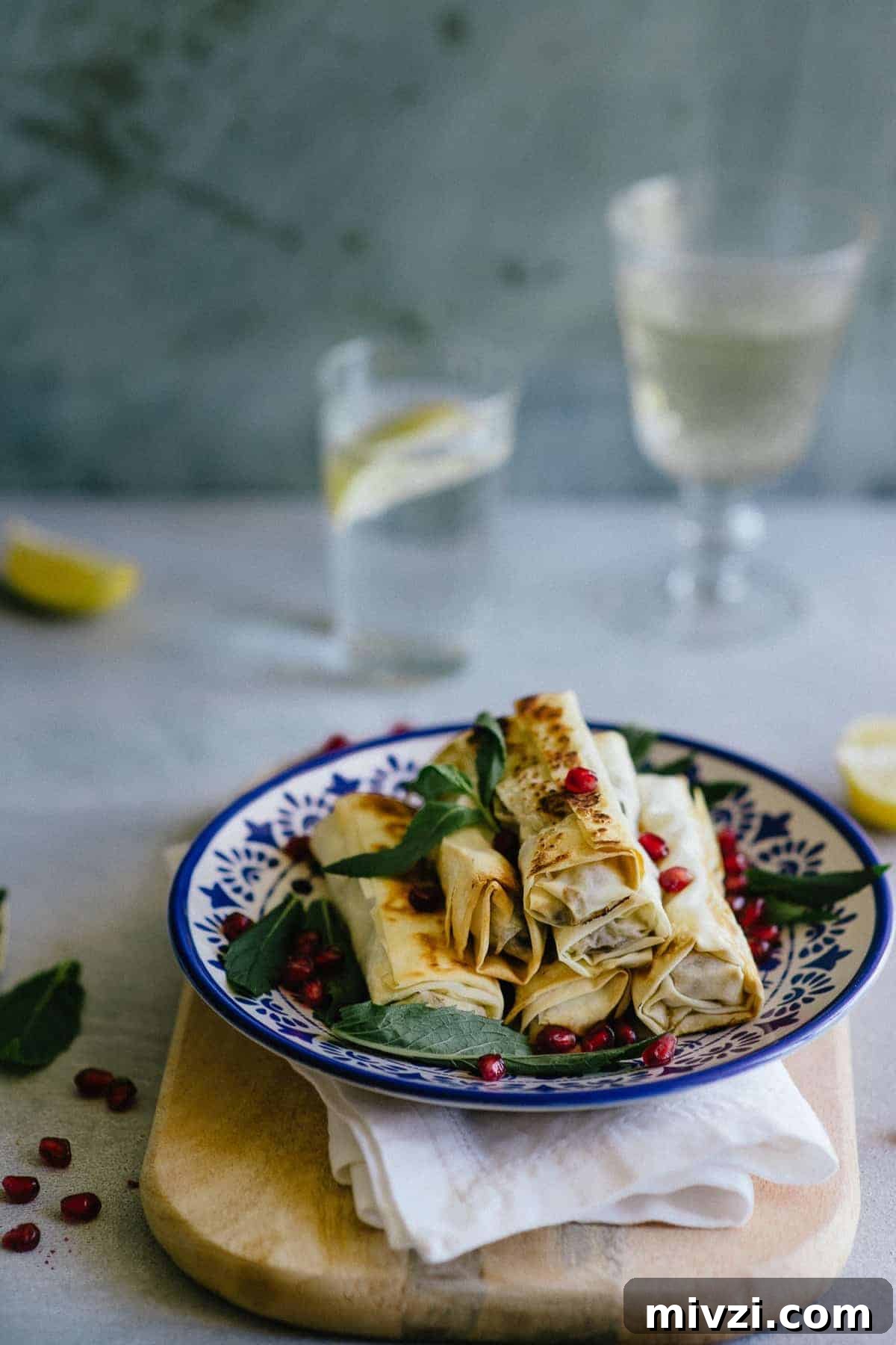 Crispy Mushroom Fillo Cigars: Savory Baked Appetizer Recipe 5 filo pastry rolled up and filled with mushrooms served on a plate