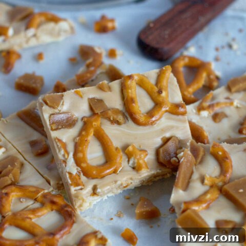 candy bark cut into pieces on parchment paper