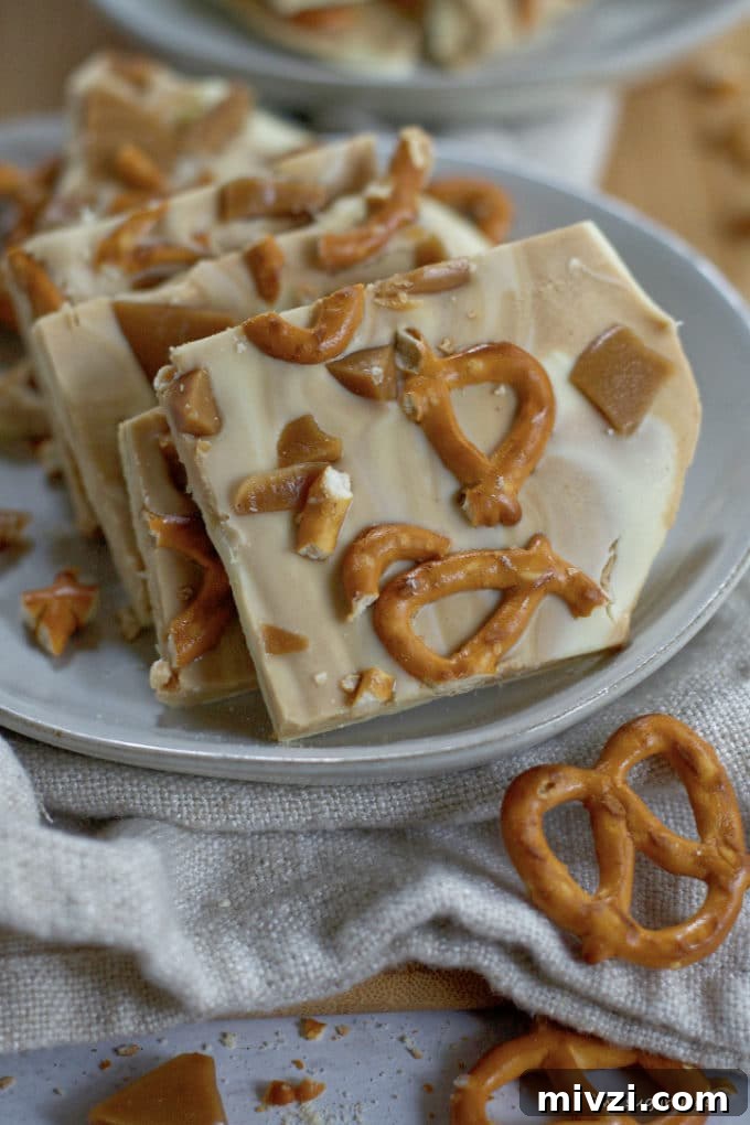 Cookie Butter White Chocolate Bark Recipe | Crunchy Cookie Butter Bark 5 cookie butter white chocolate bark on a plate