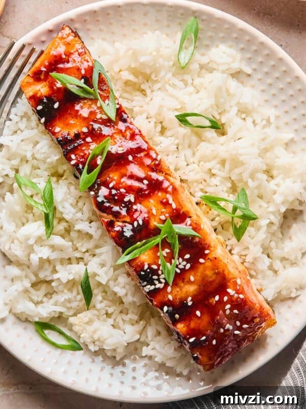 Mediterranean-Style Grilled Chicken with Lemon and Herbs 11 Grilled teriyaki salmon filet over rice with scallions and sesame seeds.