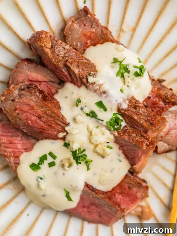 Mediterranean-Style Grilled Chicken with Lemon and Herbs 14 Sliced grilled ribeye steak sliced and served on plate with gorgonzola sauce.