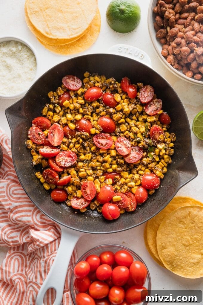 Pinto Bean Tostadas with Fresh Tomato and Corn Salsa 6 Cast iron skillet full of street corn tomato salsa with Cotija.